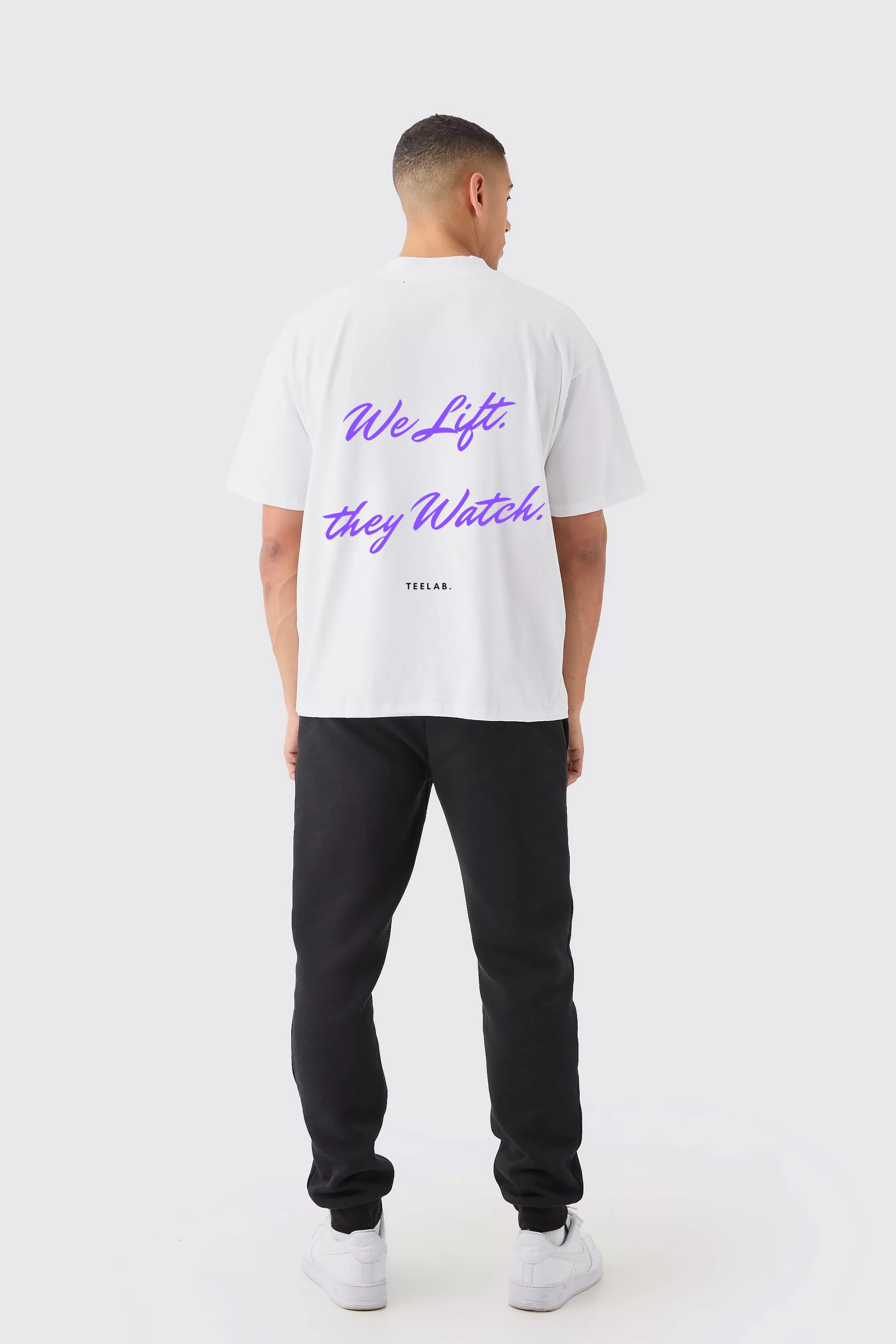 We Lift. They Watch. Tee – Statement Fit (70% Cotton, 30% Polyester)